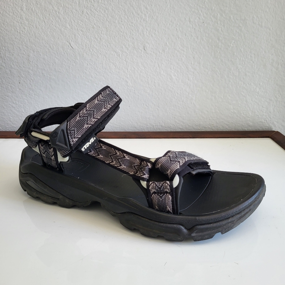 Teva Men's Black Sandals with Adjustable Straps and Rugged Soles Hiking Sandals.